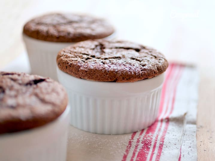chocolate souffles in white ramekins