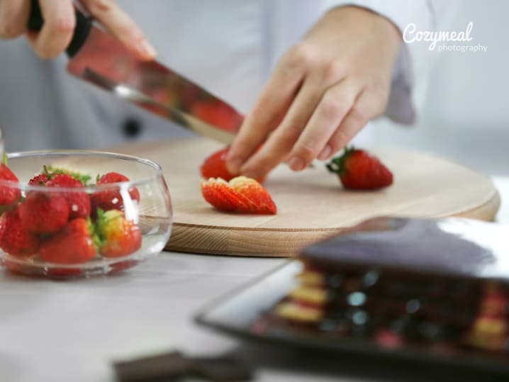 chopping strawberries