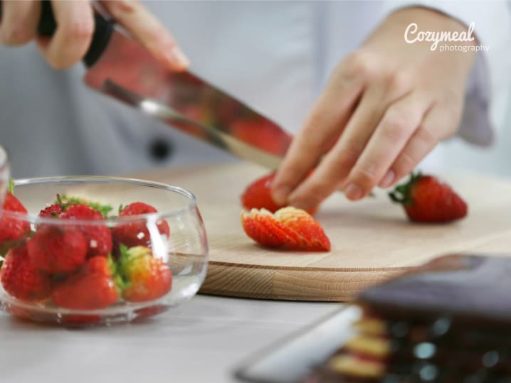 chopping strawberries