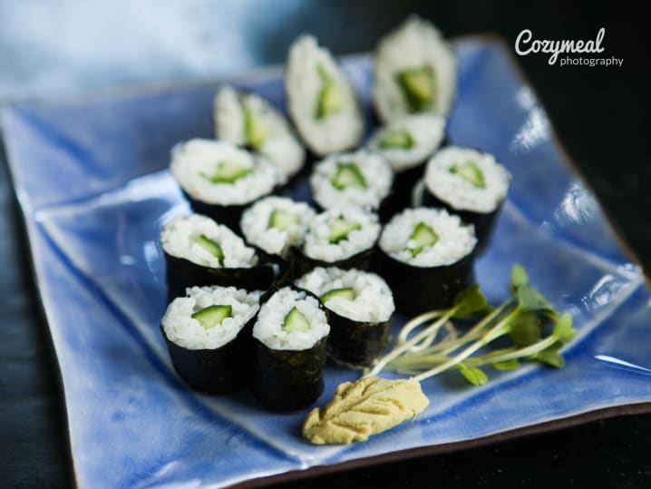 Sushi rolls with avocado and sesame seeds