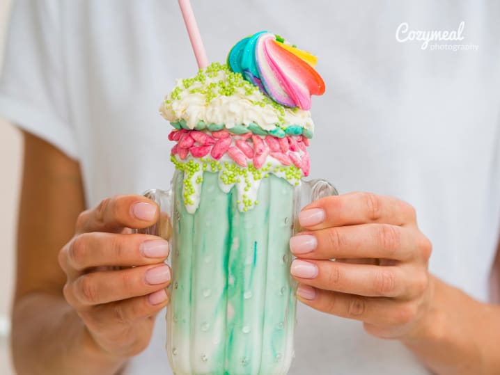 holding decorated ice cream cocktail