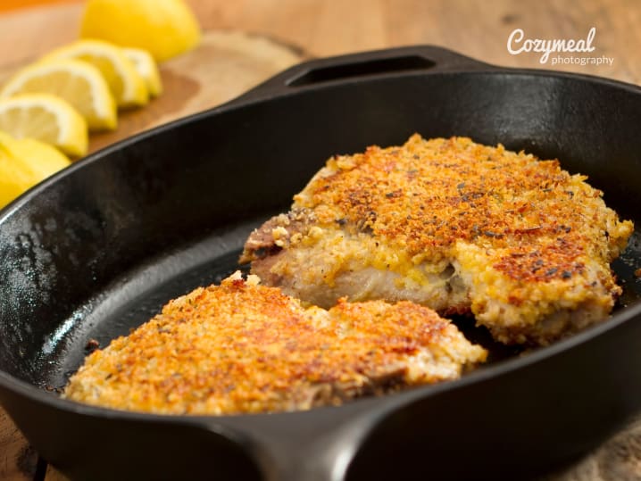 cooking crusted pork chops in a pan