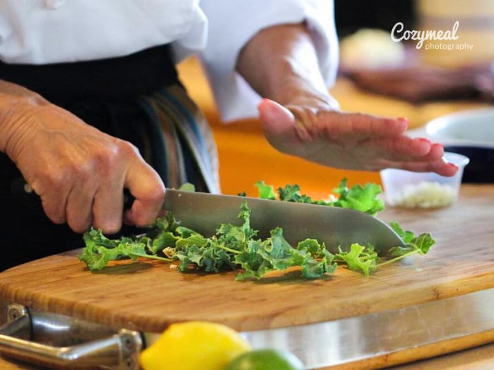Chef cutting kale