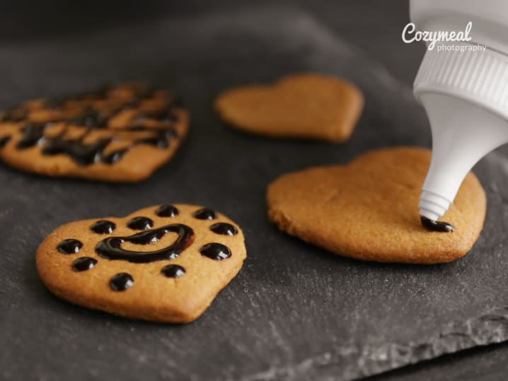 decorating cookies with chocolate ornaments
