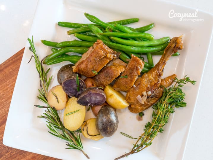 duck confit with haricots verts and potatoes