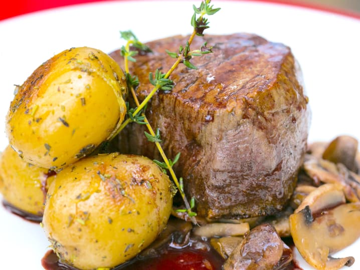 filet mignon with red wine mushroom sauce and herb roasted potatoes