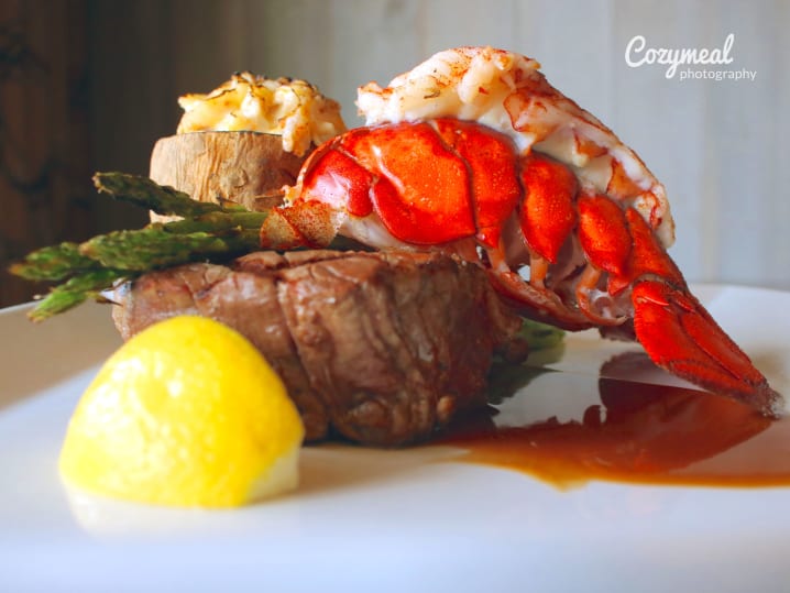 fresh lobster and beef tenderloin steak with saffron sauce and potatoes