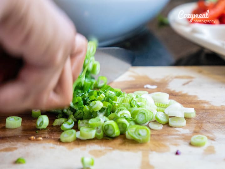 fresh scallions being chopped