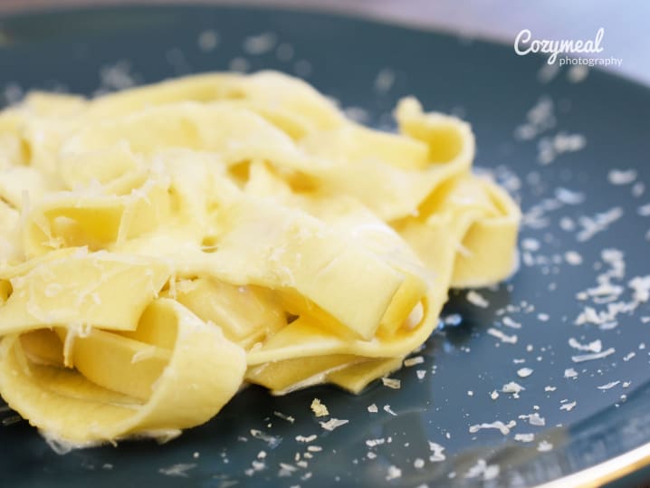 freshly make pasta with Parmesan cheese grated on top