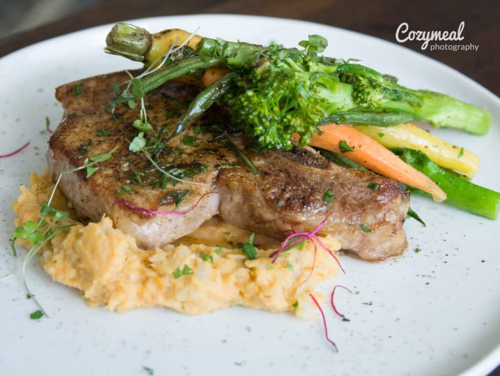 glazed pork chop with broccolini, asparagus and polenta