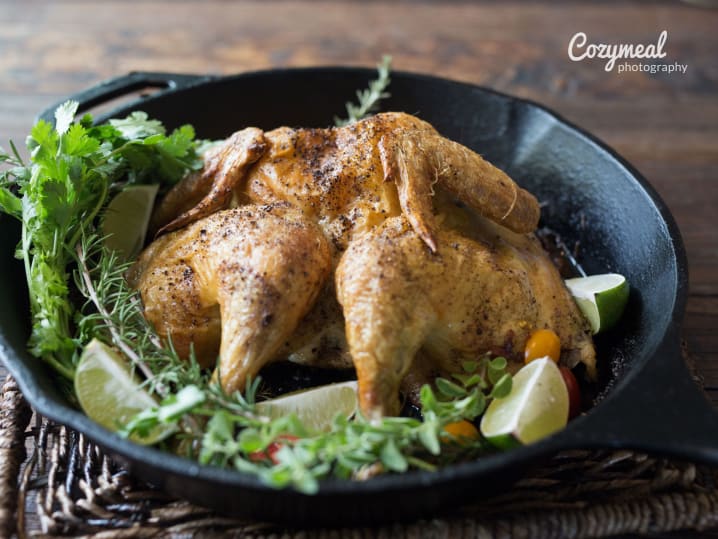 grilled chicken with rosemary in a skillet pan
