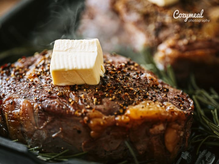 grilling juicy steak with butter