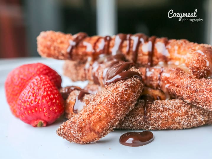 homemade churros with chocolate sauce