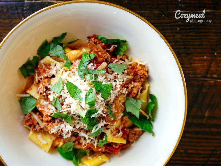 homemade pasta with red sauce and italian sausage