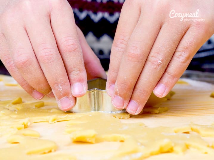 kids hands making sugar cookies