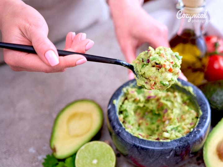 making homemade guacamole in a team building cooking class