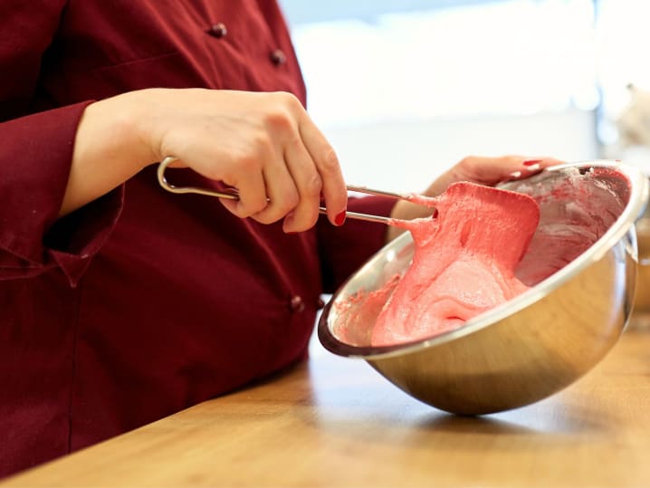 mixing batter for strawberry macarons