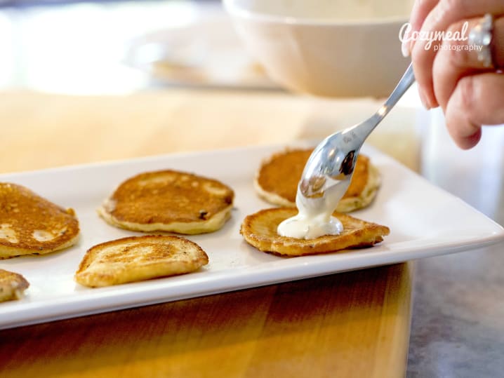 nye making Blinis with Gravlax and CreМЂme FraiМ‚che