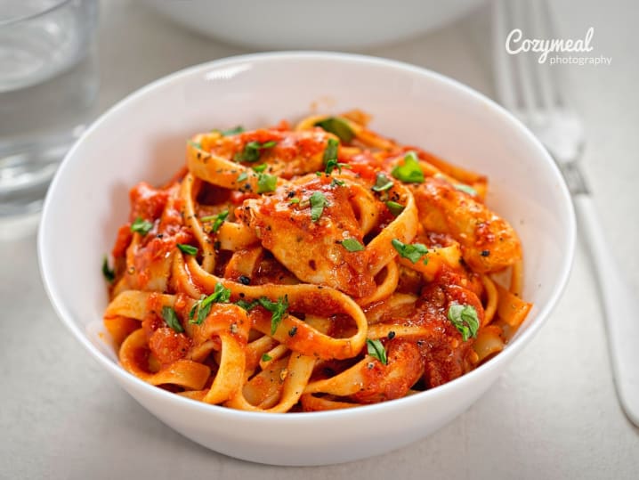 tagliatelle pasta in tomato and basil sauce
