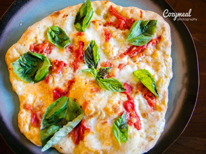 pizza with basil and tomatoes