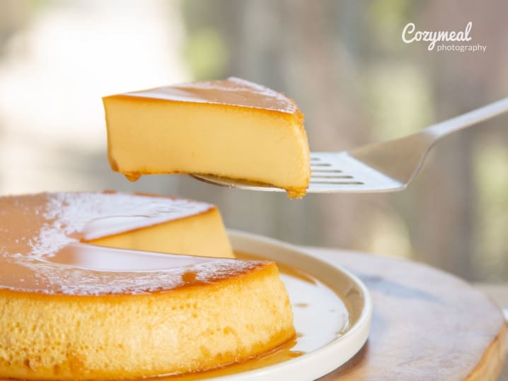 chef plating slice of freshly baked tres leches cake