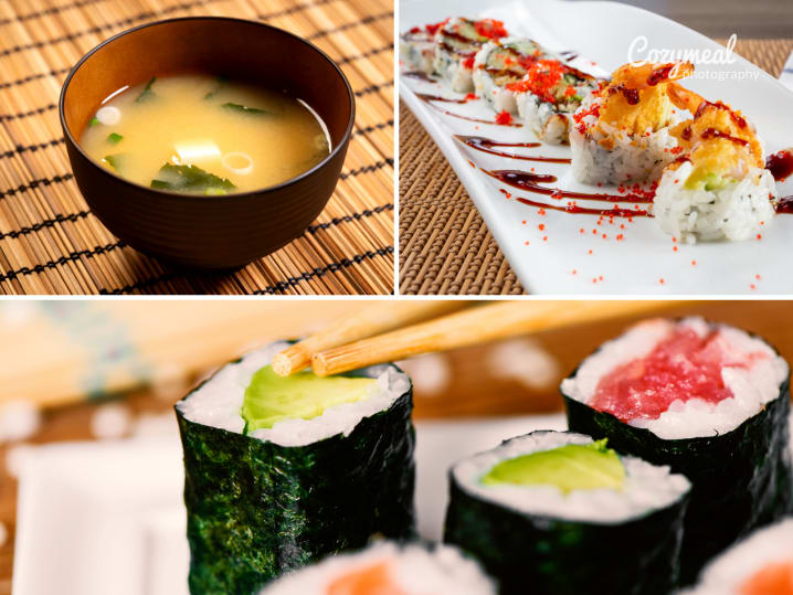 bowl of miso soup, plate of tempura shrimp sushi rolls and assortment of maki sushi rolls