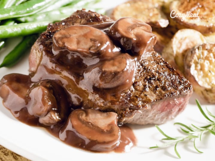 steak diane with roasted potatoes and vegetables