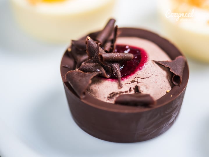 raspberry mousse dessert in a chocolate glass