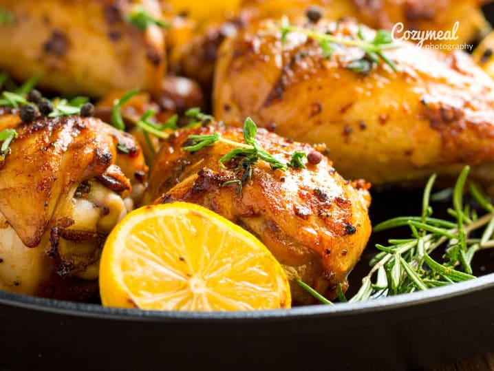 roasted chicken with rosemary and lemon on the side