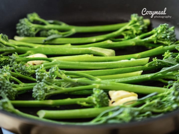 roasting broccolini in a pan with butter