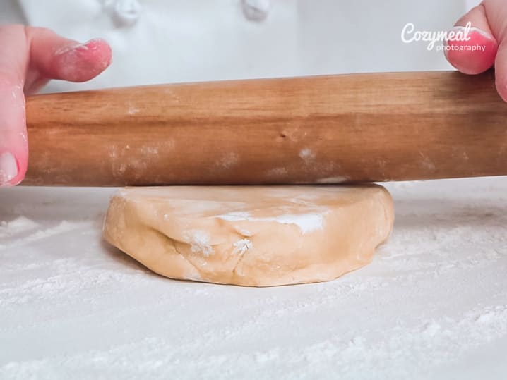 rolling out sugar cookie dough
