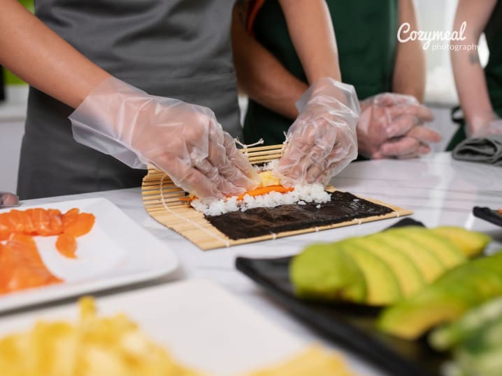 rolling sushi together