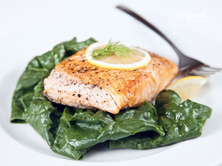 salmon confit on sauteed spinach salad