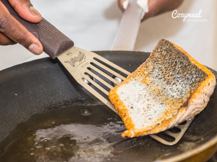 searing salmon in a pan