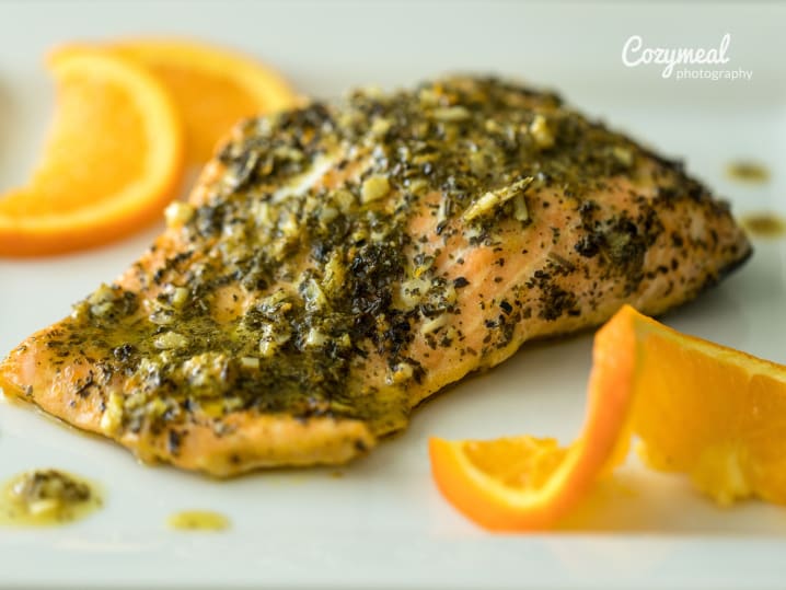 seasoned fillet of fish with orange slices