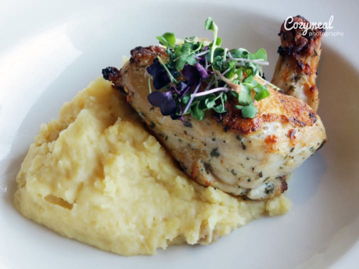 Creamy garlic chicken with polenta, fried garlic chips and asparagus