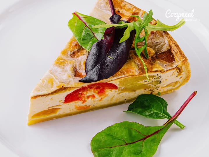 slice of fresh Quiche with salad