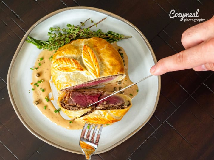 slicing into beef wellington