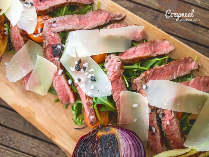 steak tagliata with shaved parmesan cheese