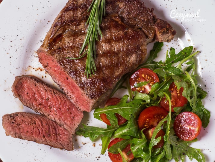 steak with arugula salad on the side