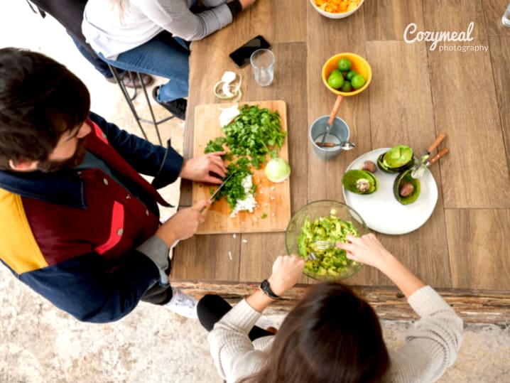 team making guacamole together