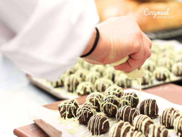 topping truffles with chocolate