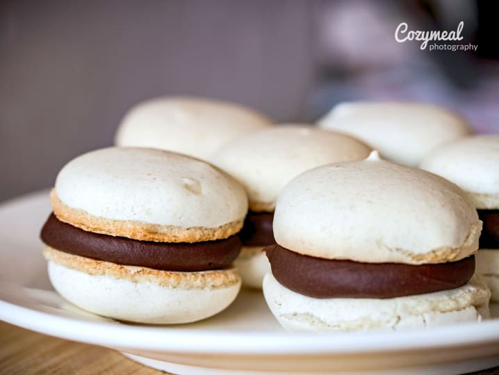 vanilla macaron shells with chocolate ganache