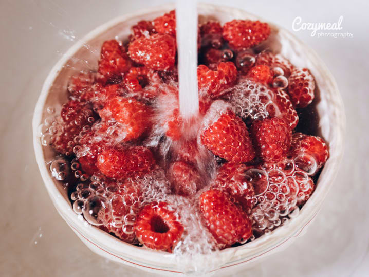 washing raspberries