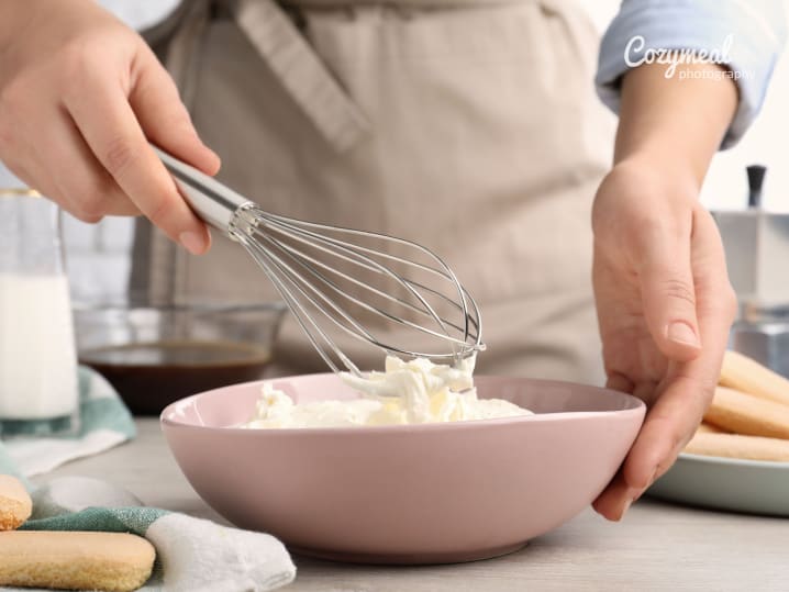 whisking mascarpone cream in a bowl for tiramisu