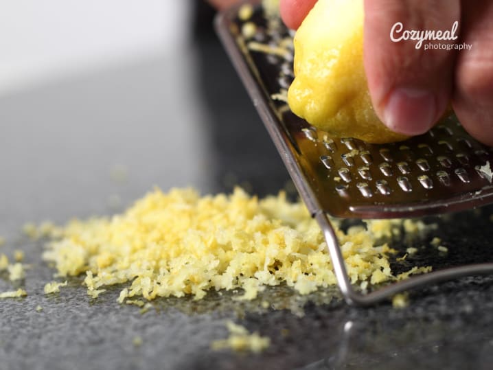 zesting a lemon up close