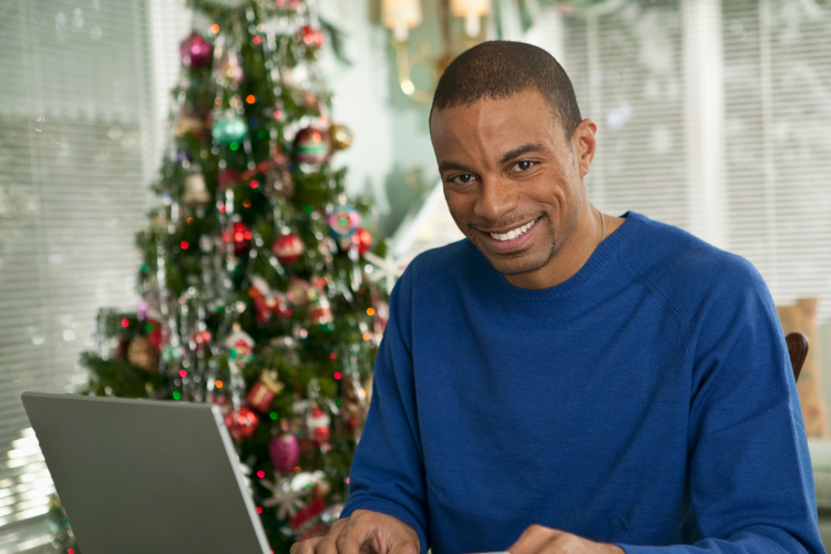 man playing virtual mad libs during a virtual christmas party
