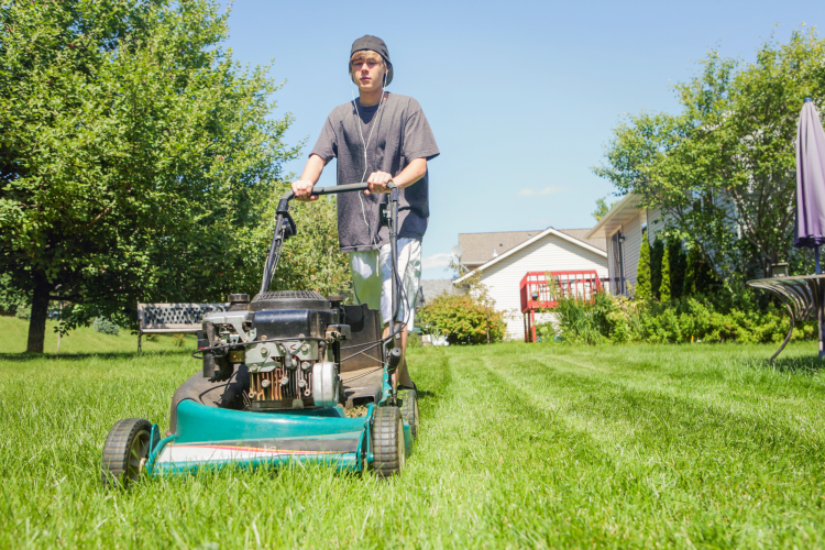 Teen mowing the lawn