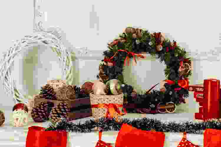 christmas wreath, ornaments and decor on a shelf