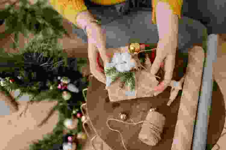 woman wrapping a gift during a gift wrapping competition